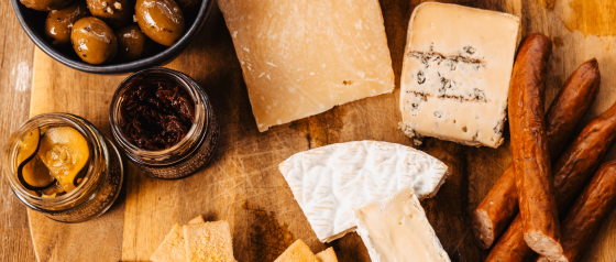 Cheese board with cheeses, olives and Bier Sticks.