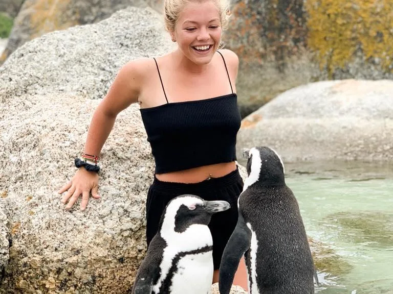 Image of Annabelle with two penguins at Swell Stays team providing holiday home management services in Margaret River